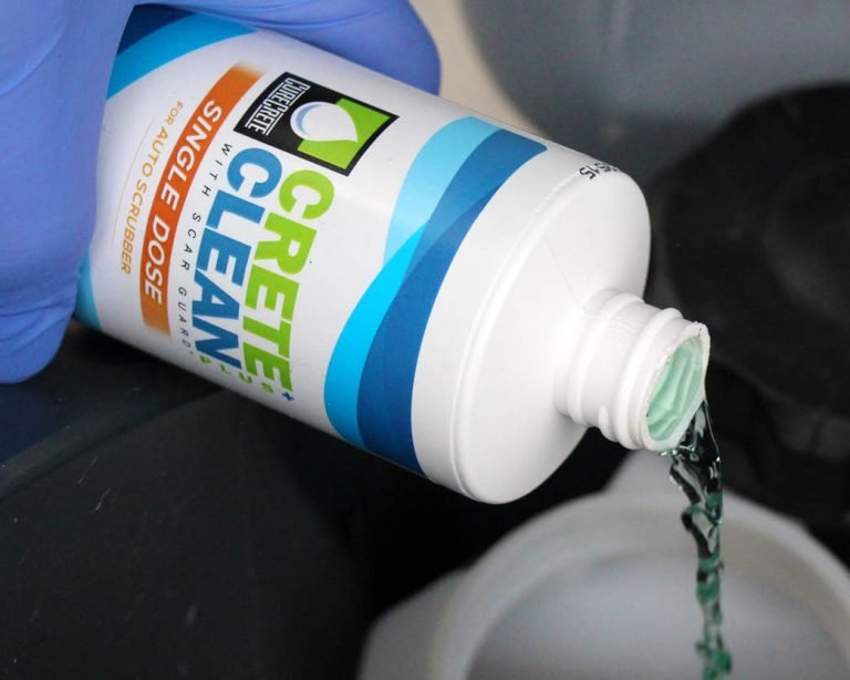 CreteClean Plus concrete floor cleaner single dose bottle being poured