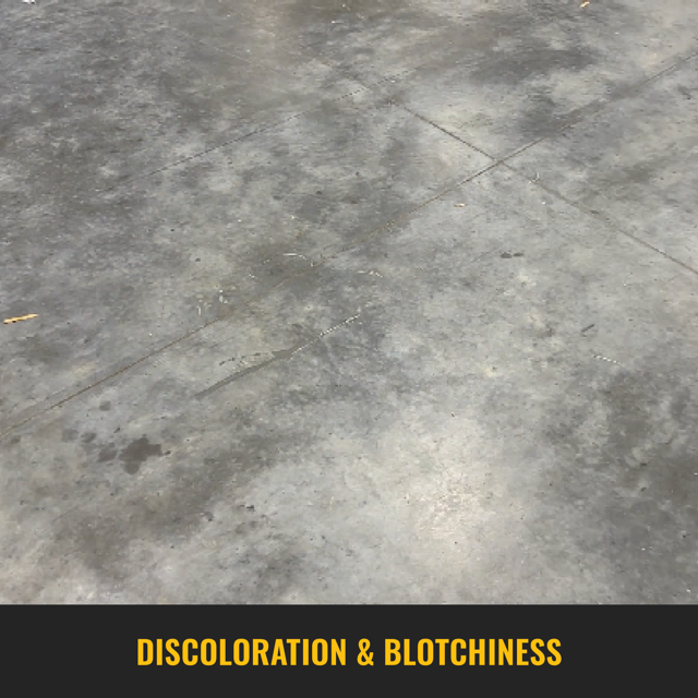 Top-down view of concrete floor showcasing uneven color and blotchiness on the surface of the concrete.